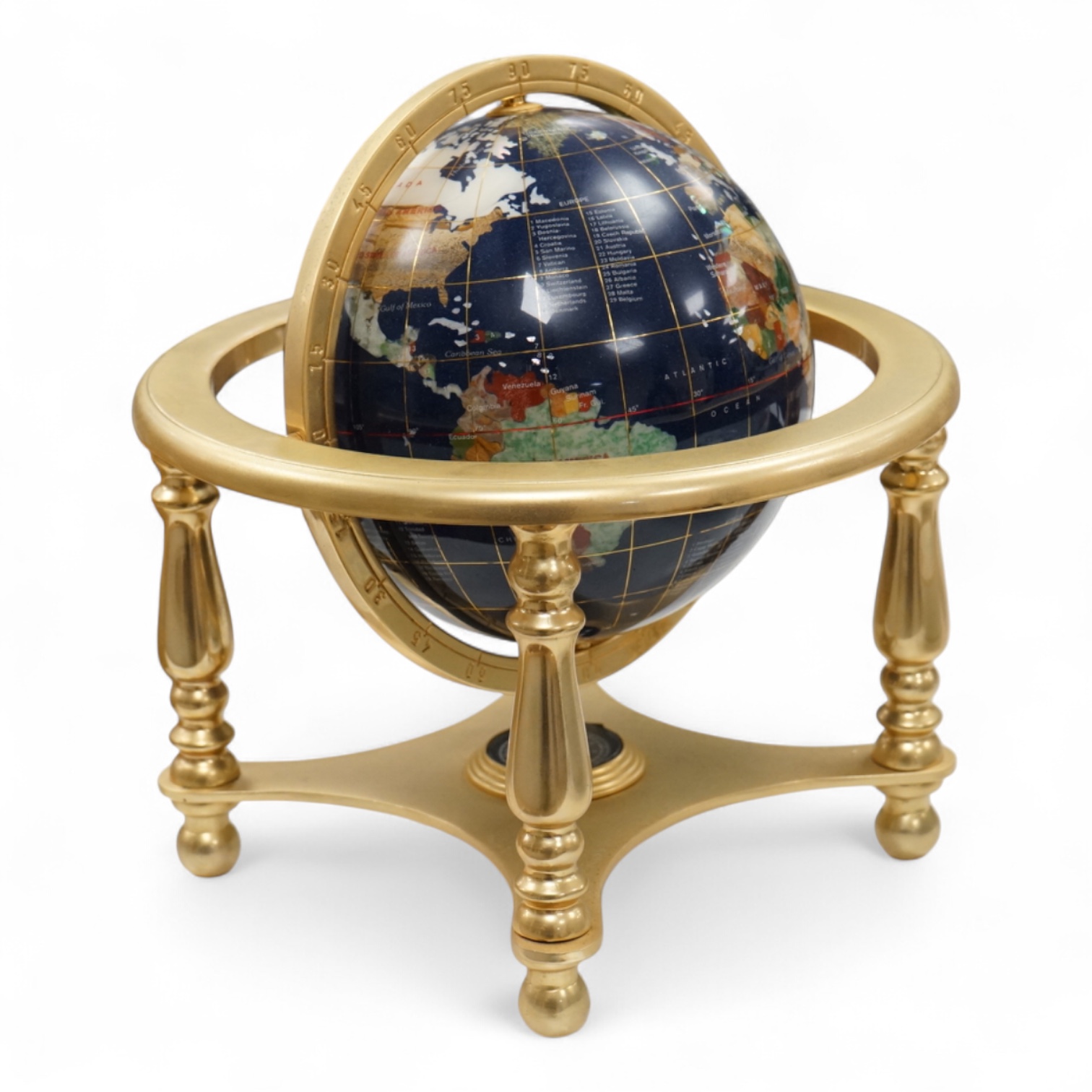 A table-top globe, on brass gimbal stand, 23cm in diameter